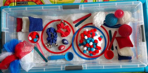 Maddie will further develop her fine motor skills as she plays with the sensory table